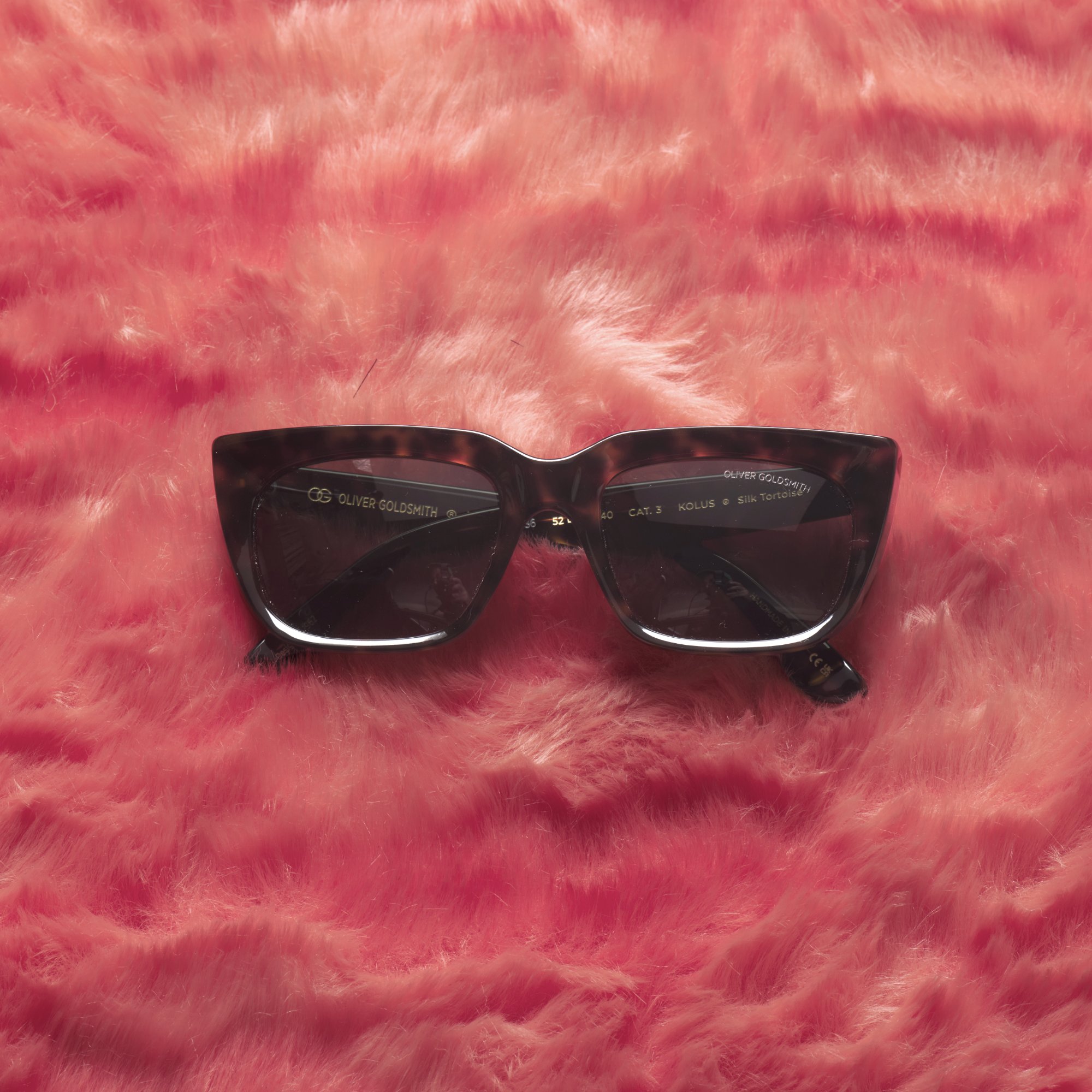 Oliver Goldsmith tortoise wayfarer on pink fur